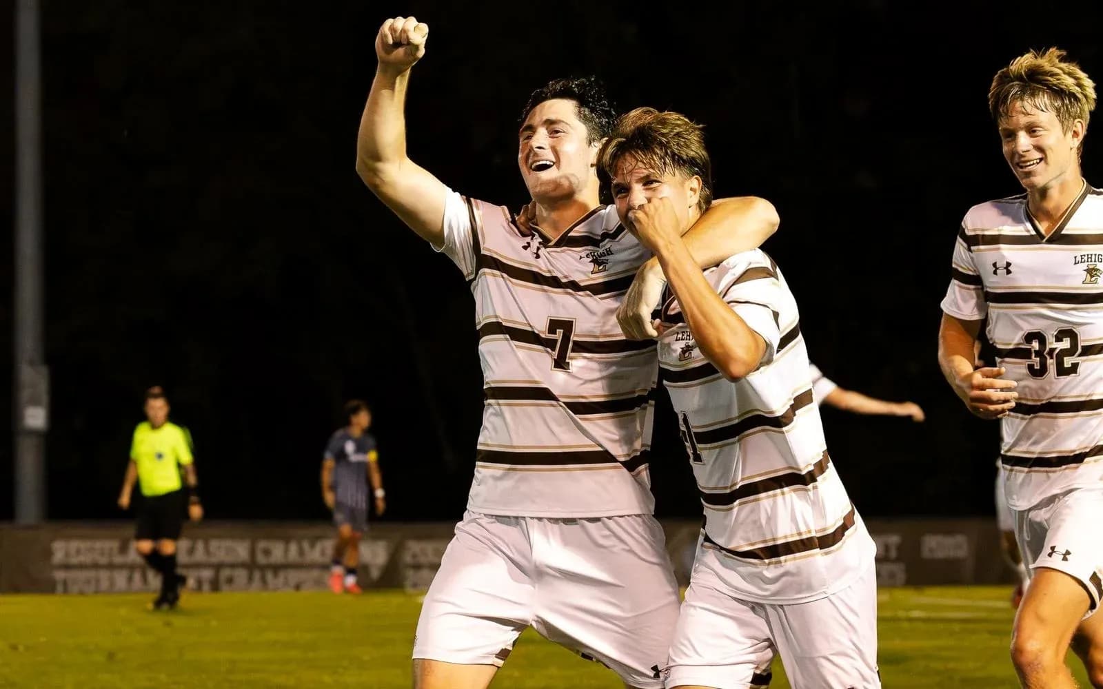 Lehigh players celebrating a goal on the field Lehigh players celebrating a goal on the field