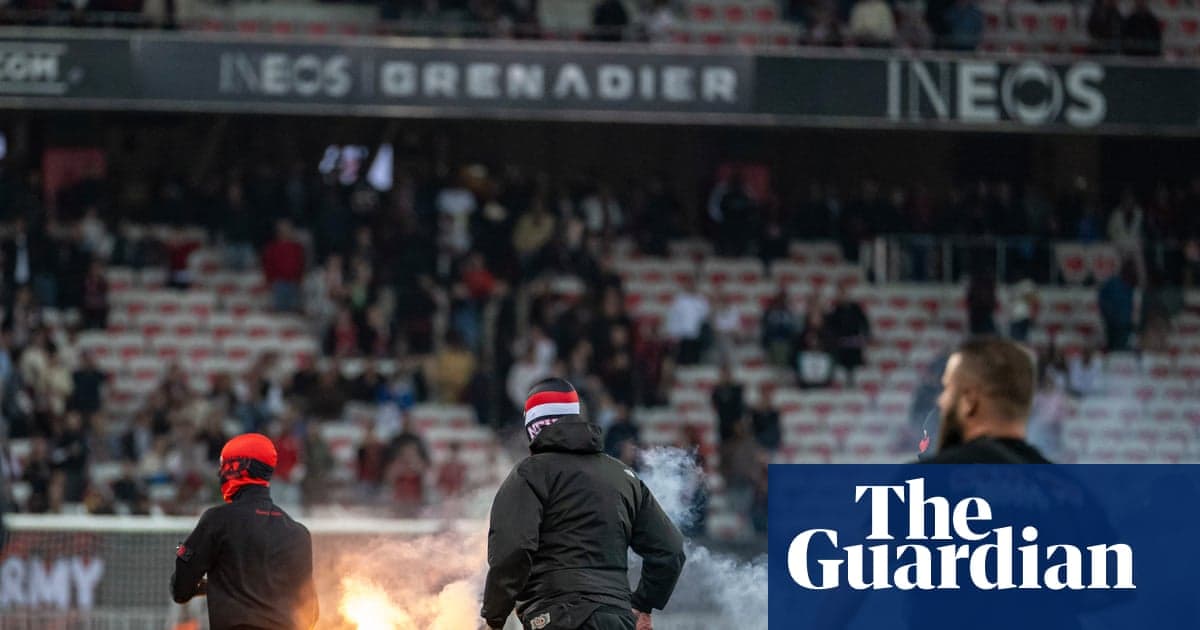 Fans setting off flares in stadium stands Fans setting off flares in stadium stands