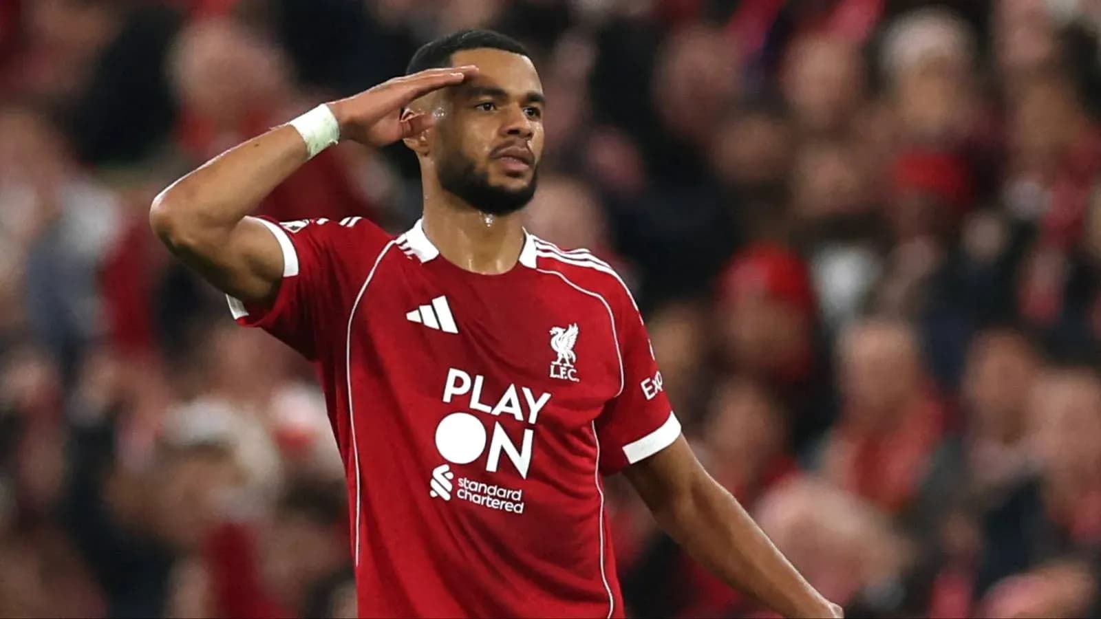 Player saluting fans during Liverpool match celebration Player saluting fans during Liverpool match celebration