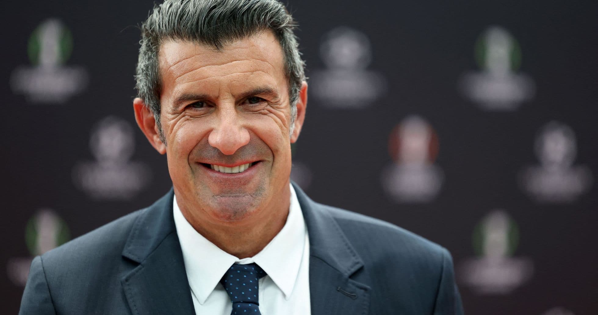 Man smiling in formal attire at event Man smiling in formal attire at event