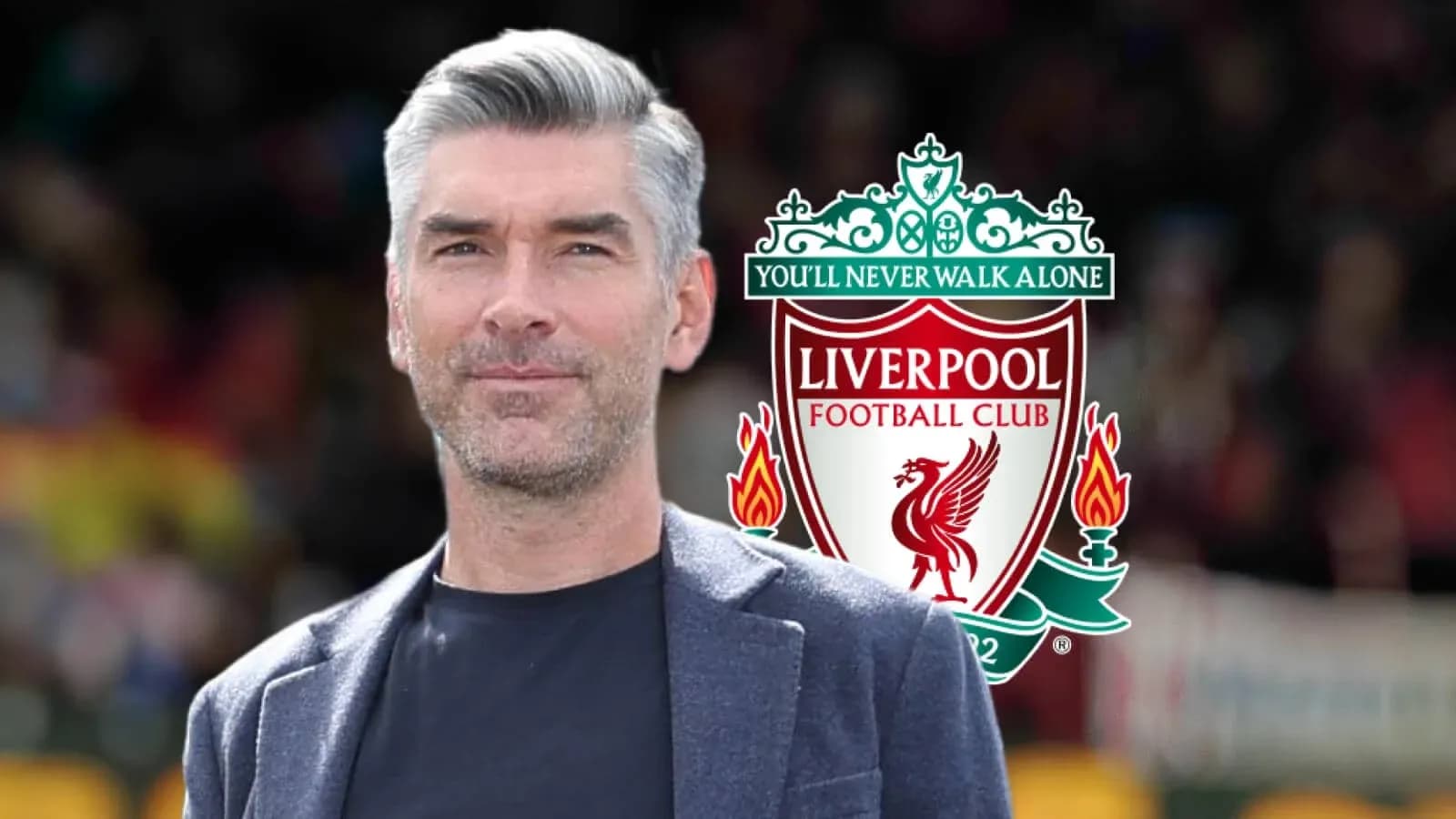 Man in suit with Liverpool FC logo background Man in suit with Liverpool FC logo background