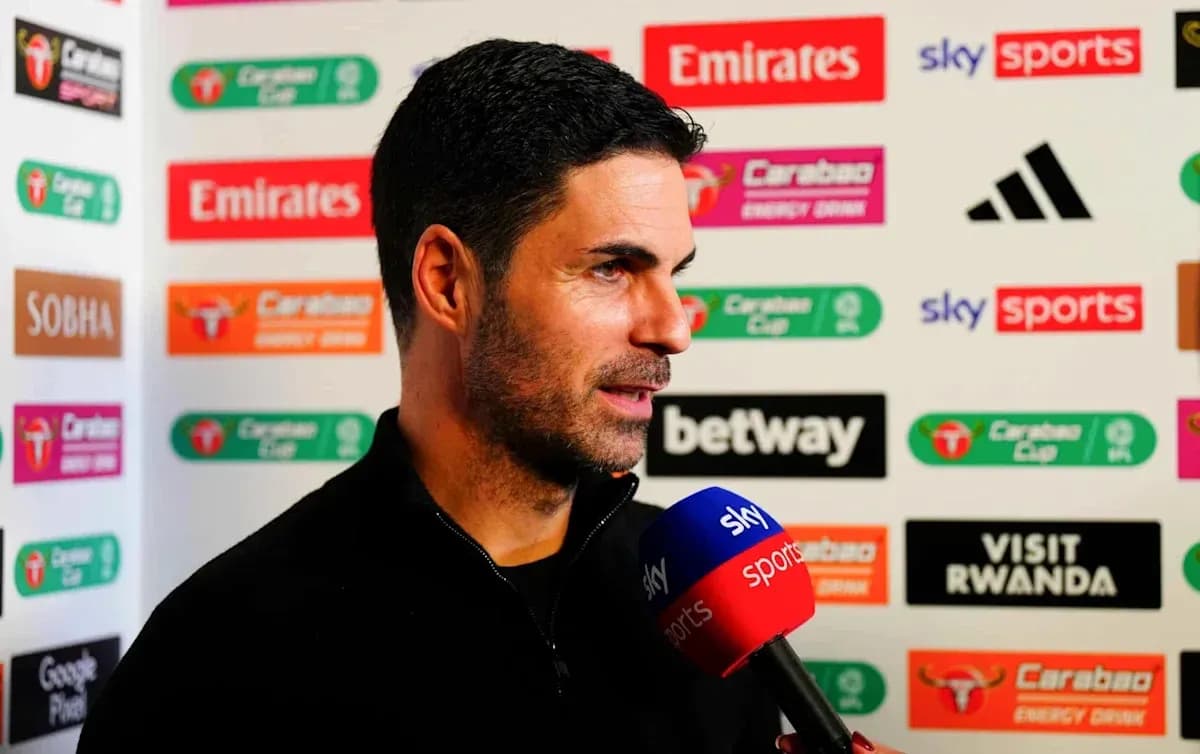 Manager speaking during post-match interview with microphone Manager speaking during post-match interview with microphone