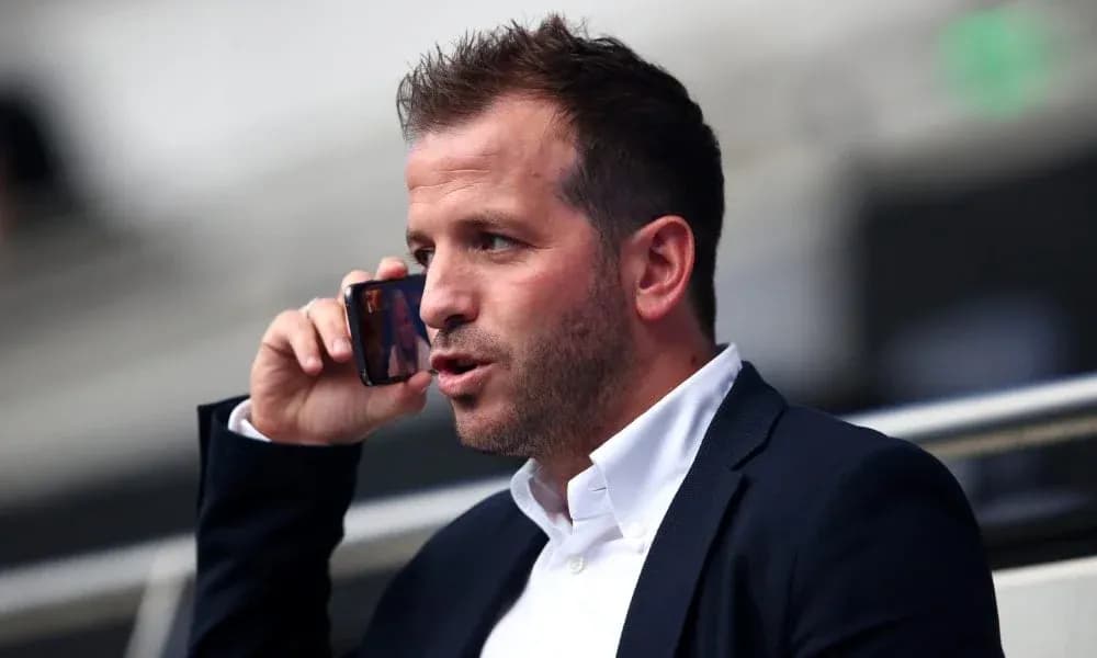 Man talking on phone in stadium seating area Man talking on phone in stadium seating area