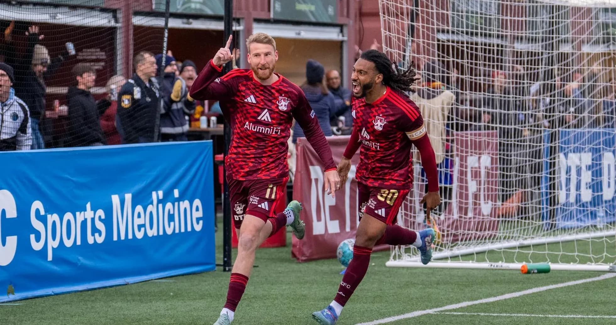 Players celebrating a goal during USL match Players celebrating a goal during USL match