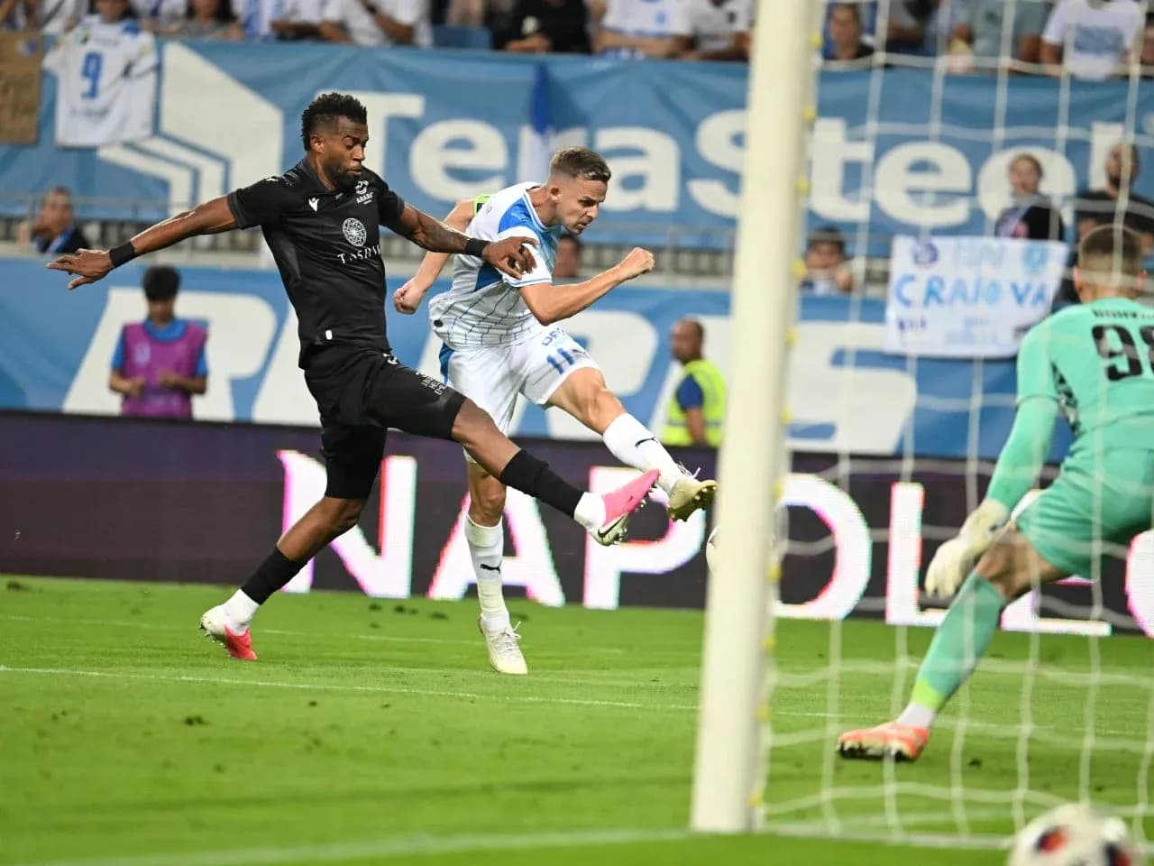 Universitatea Craiova player shooting on goal Universitatea Craiova player shooting on goal