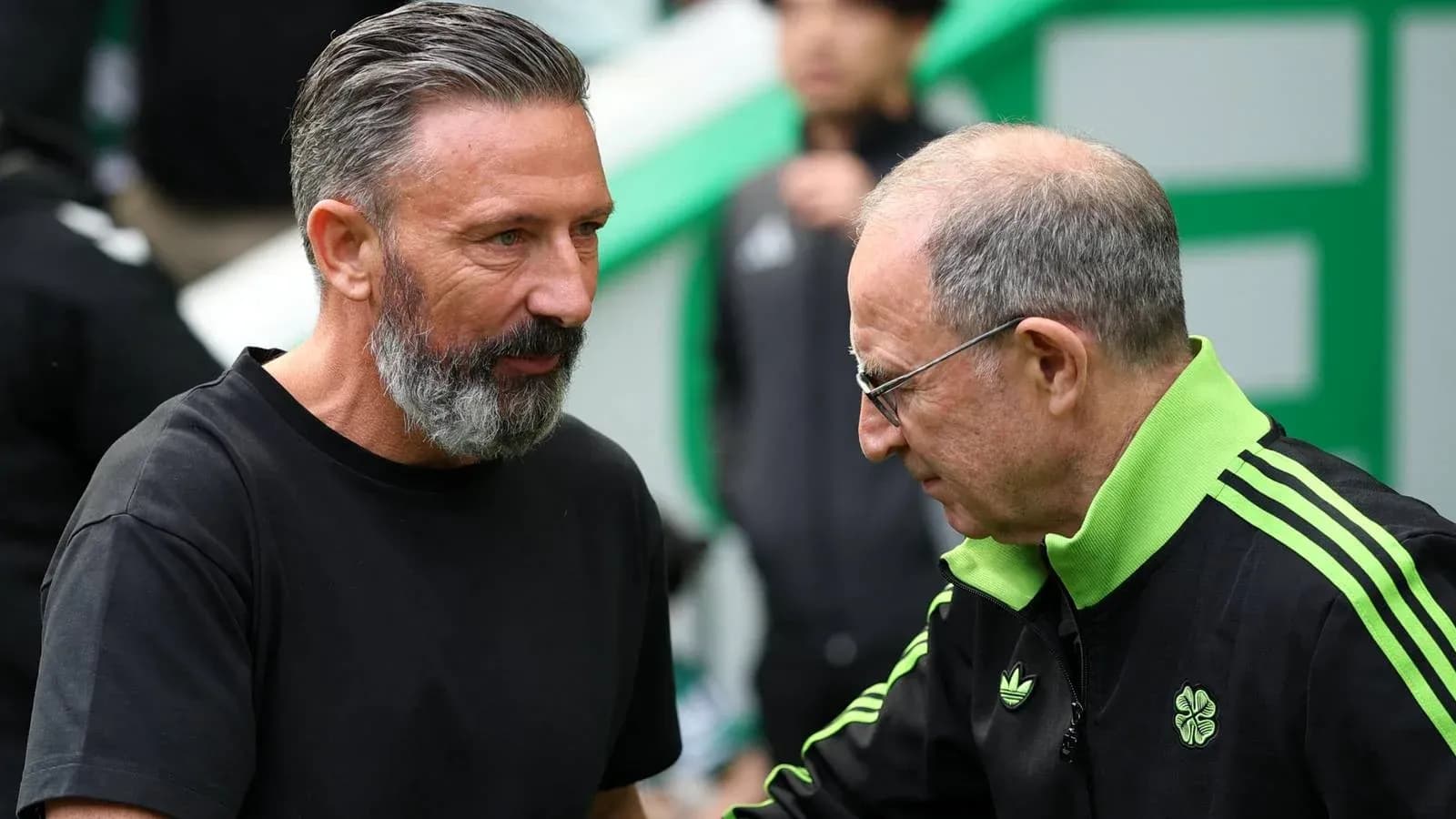 Two coaches greeting each other before the match Two coaches greeting each other before the match