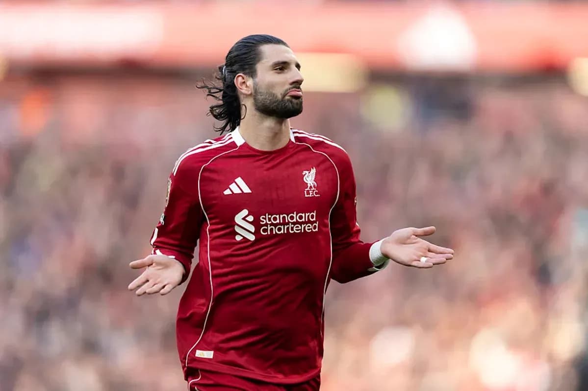 Player gesturing during match in Liverpool kit Player gesturing during match in Liverpool kit