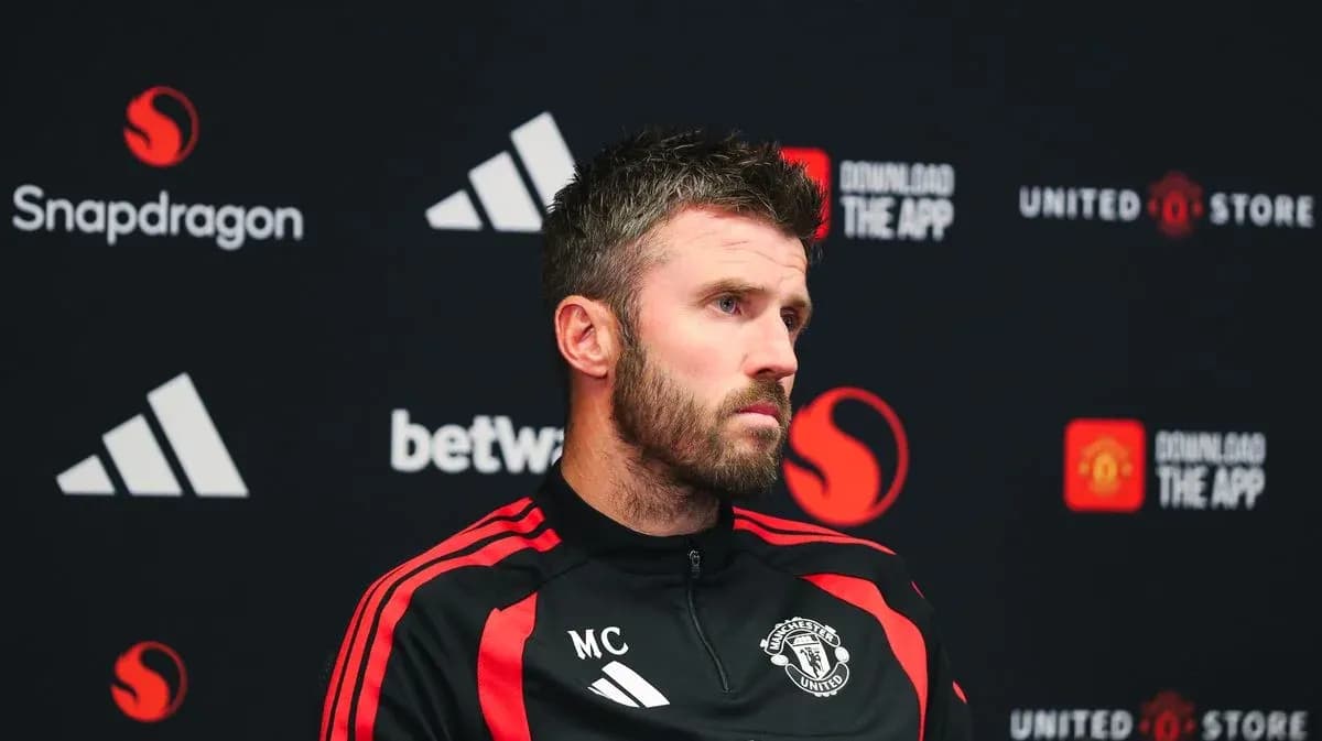 Manager at press conference with Manchester United branding Manager at press conference with Manchester United branding