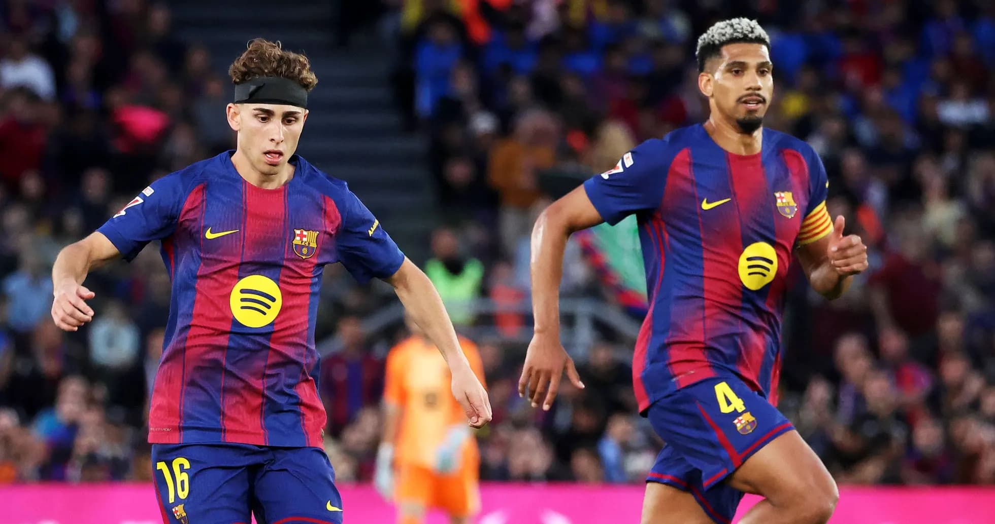 Two FC Barcelona players during a match Two FC Barcelona players during a match