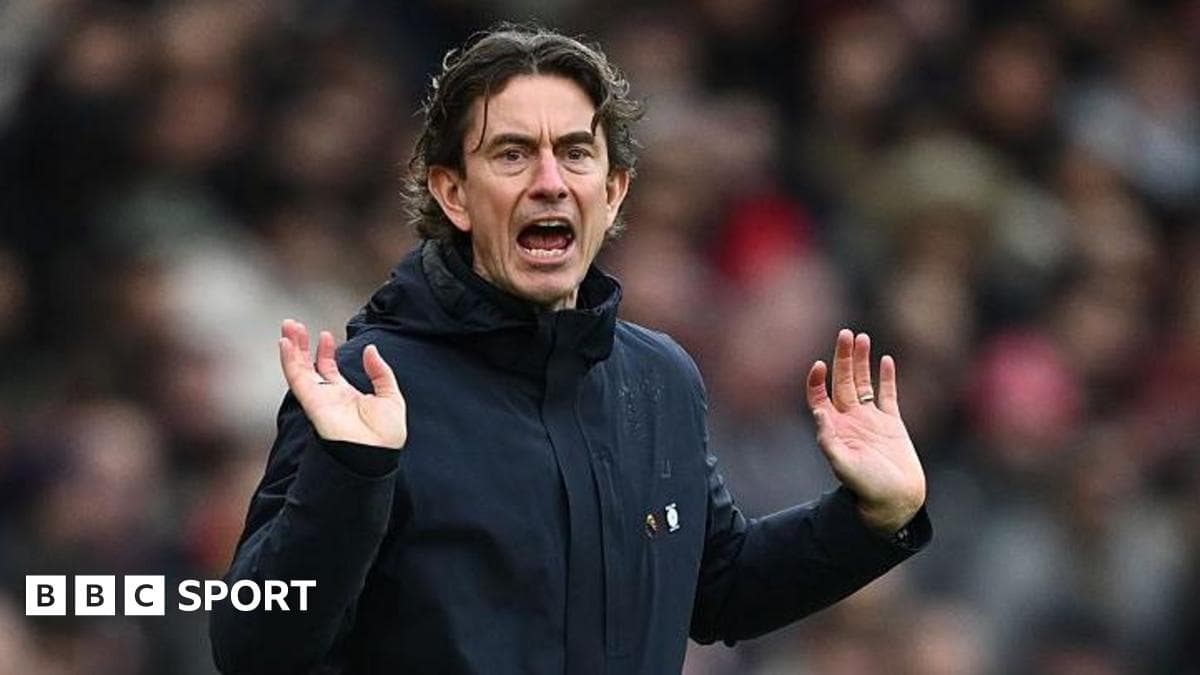 Manager gesturing during a match from the sideline Manager gesturing during a match from the sideline