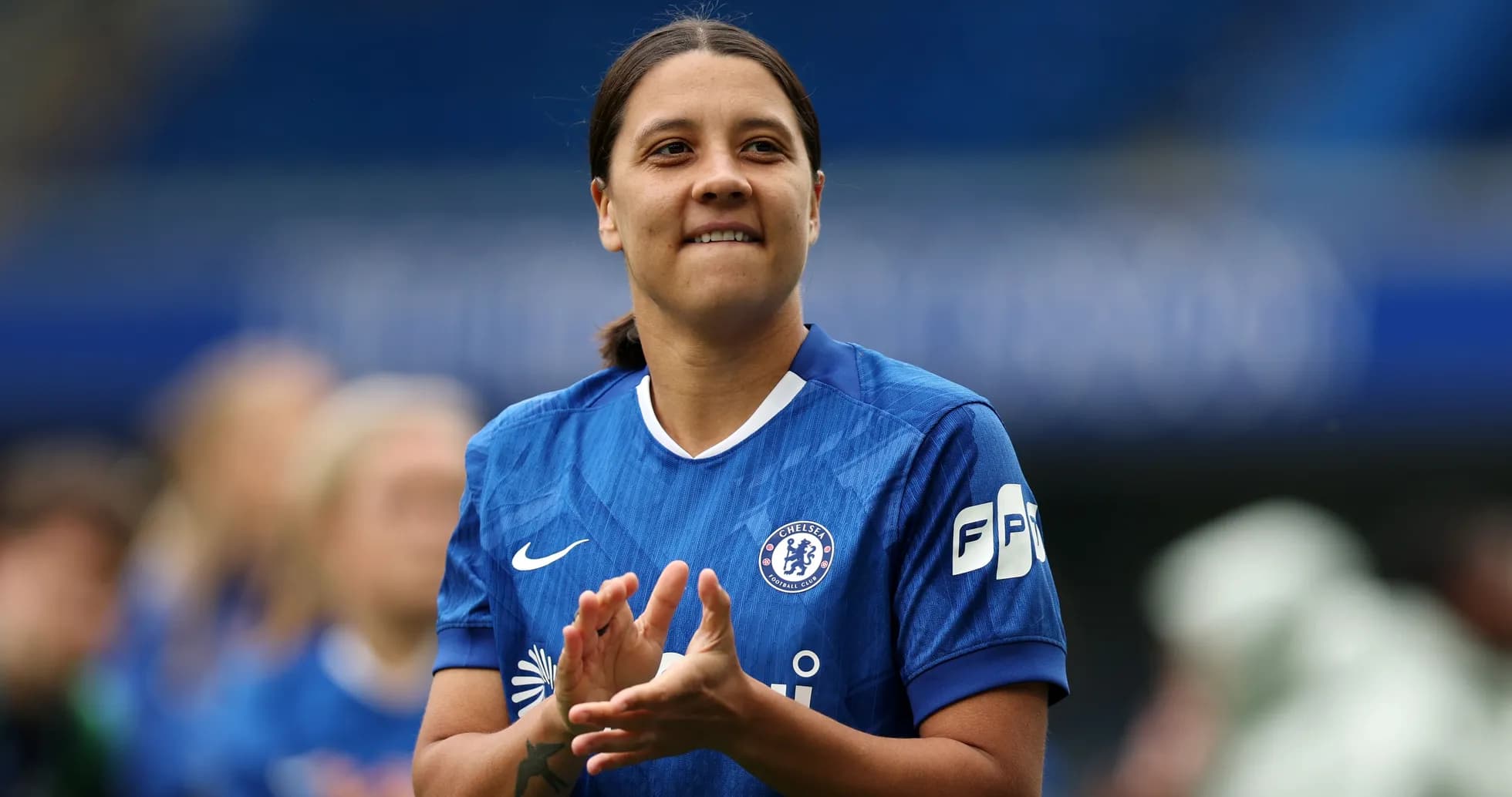 Player in blue Chelsea kit clapping hands Player in blue Chelsea kit clapping hands
