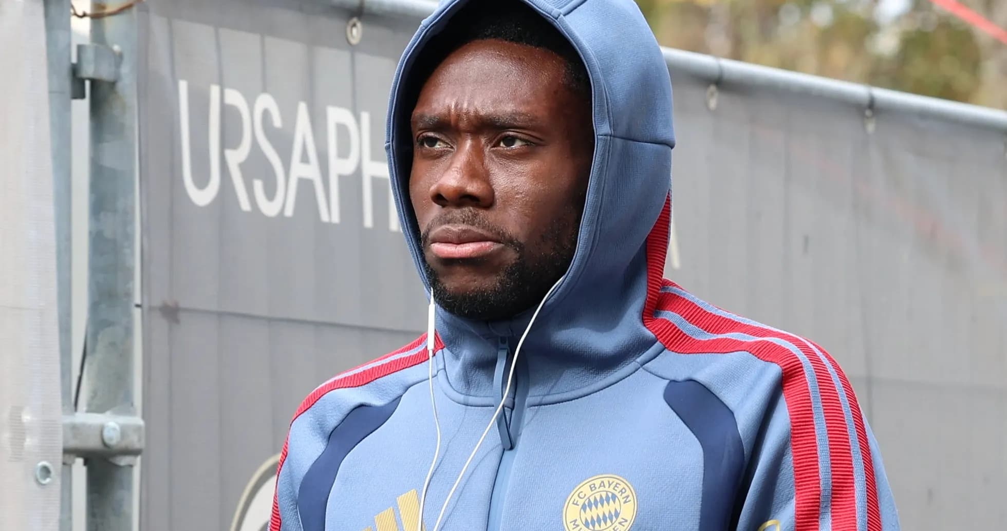 Player wearing Bayern Munich hoodie before training Player wearing Bayern Munich hoodie before training