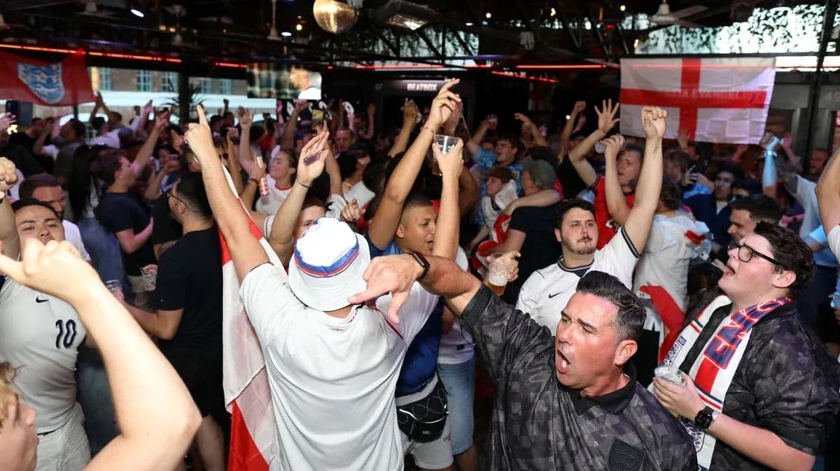 Crowd of fans celebrating in a bar Crowd of fans celebrating in a bar