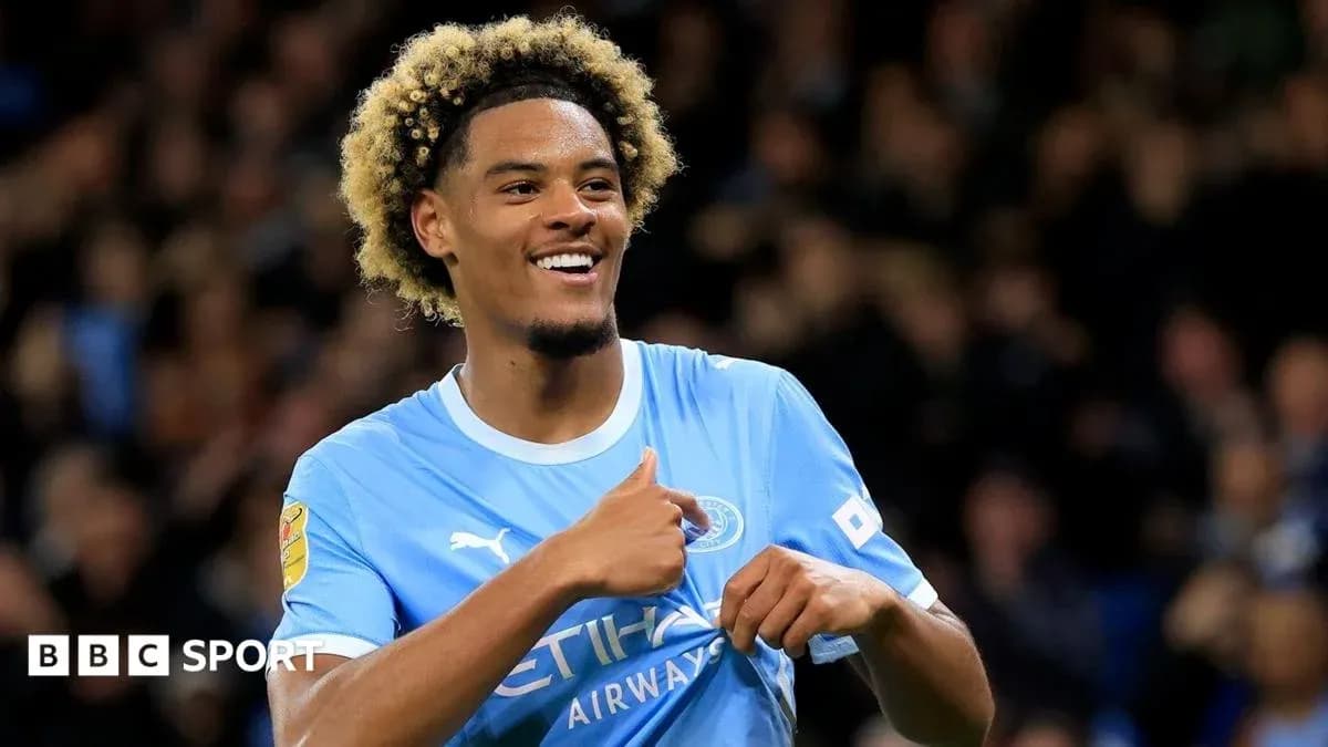 Player celebrating a goal in Manchester City jersey Player celebrating a goal in Manchester City jersey