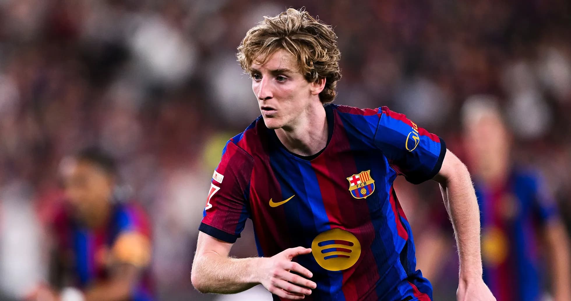 Barcelona player sprinting during a match Barcelona player sprinting during a match