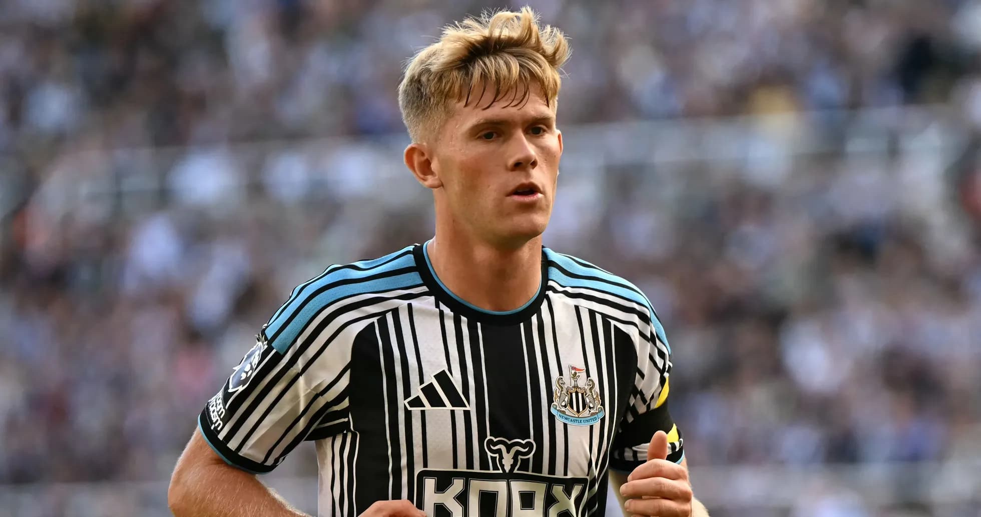 Newcastle player running during match at stadium Newcastle player running during match at stadium