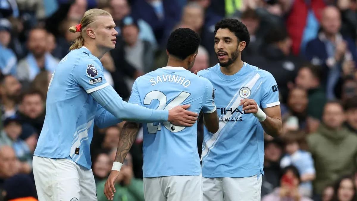 Three Manchester City players discussing during match Three Manchester City players discussing during match