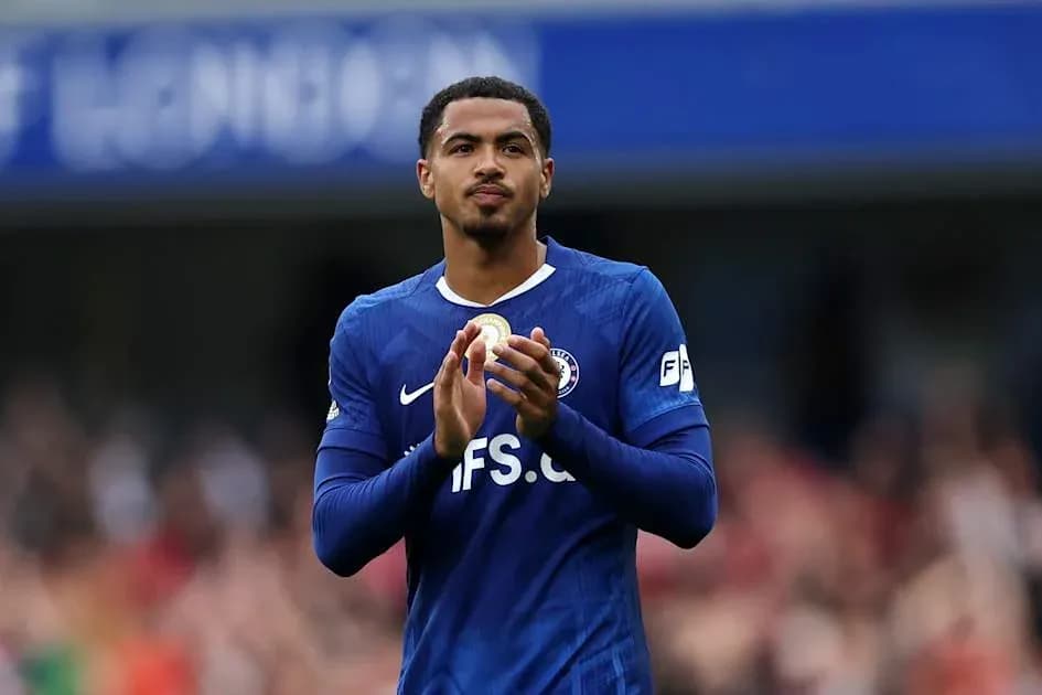 Player applauding fans in blue jersey Player applauding fans in blue jersey