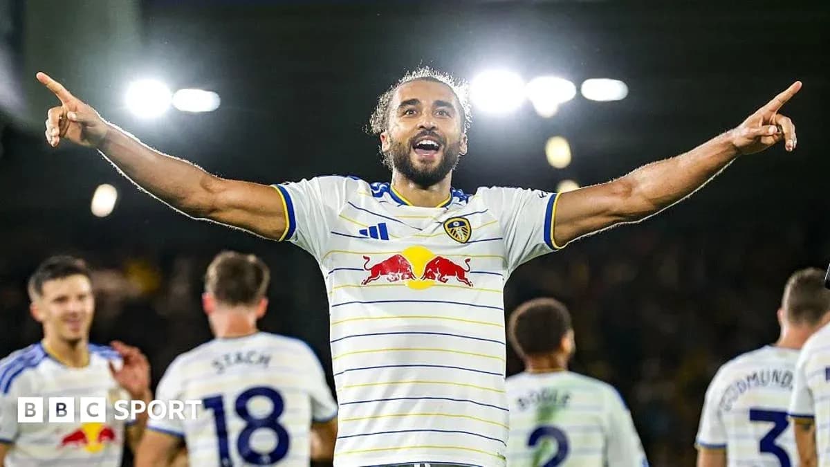 Player celebrating after scoring a goal for Leeds United Player celebrating after scoring a goal for Leeds United