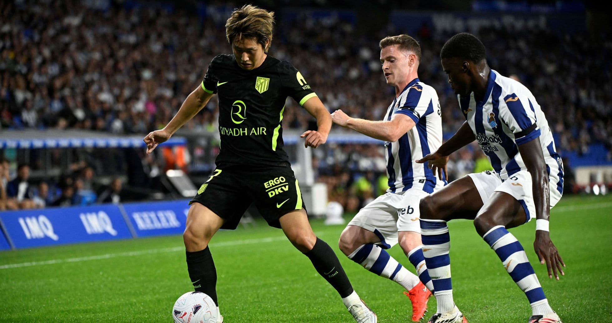 Atletico Madrid player dribbling against Real Sociedad Atletico Madrid player dribbling against Real Sociedad