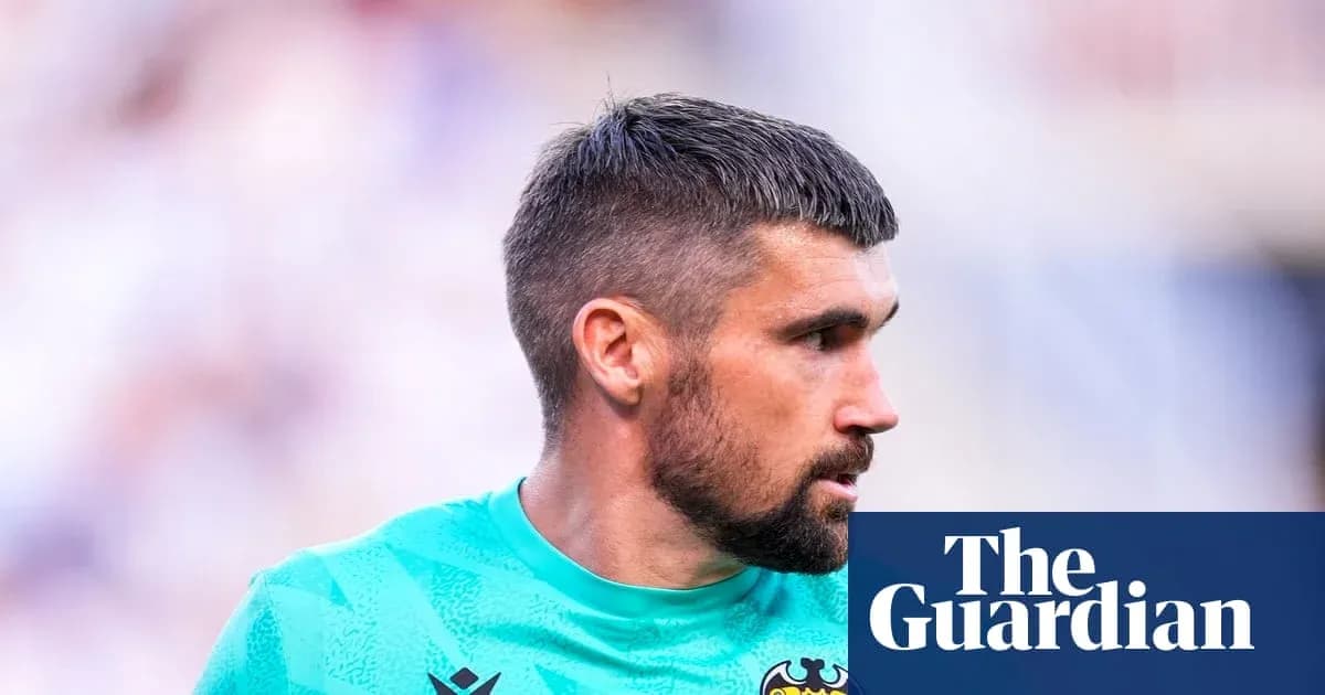Goalkeeper wearing green kit during match Goalkeeper wearing green kit during match