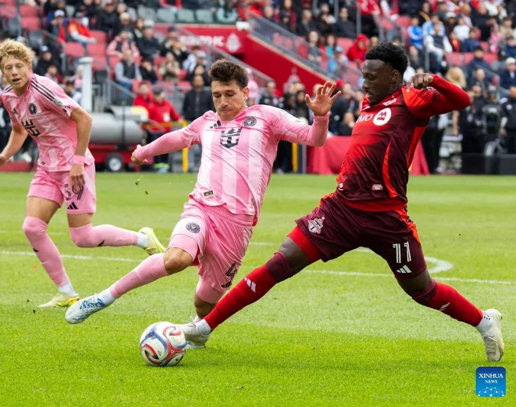 Inter Miami players challenging Toronto FC in match Inter Miami players challenging Toronto FC in match