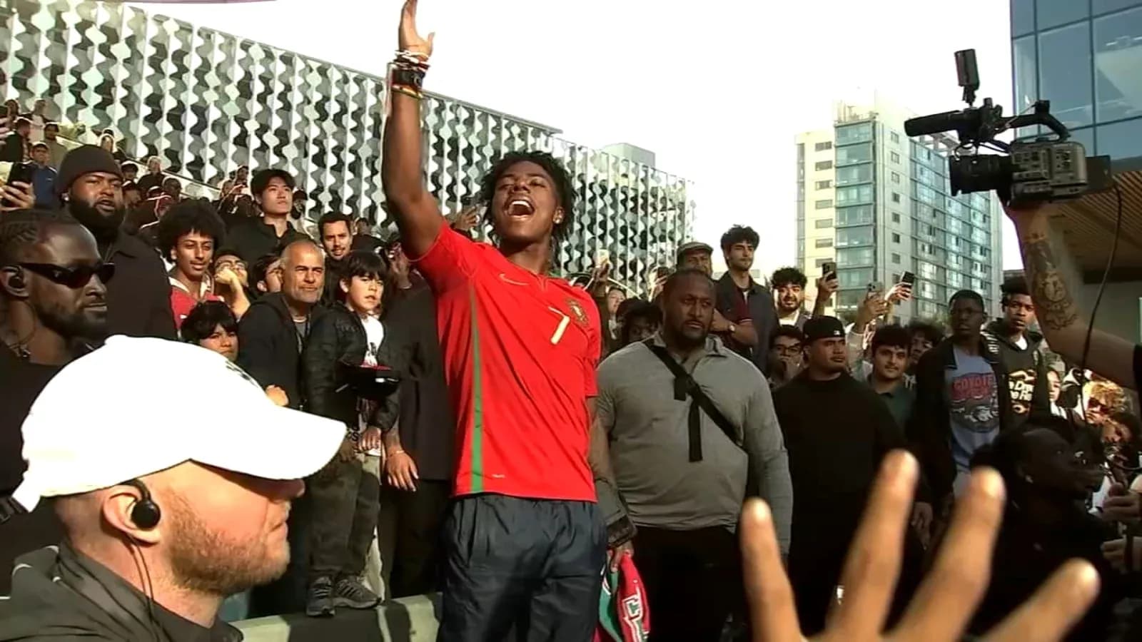 Fan in Portugal jersey celebrating among crowd Fan in Portugal jersey celebrating among crowd