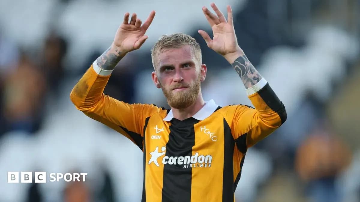 Player waving to fans after match in team jersey Player waving to fans after match in team jersey