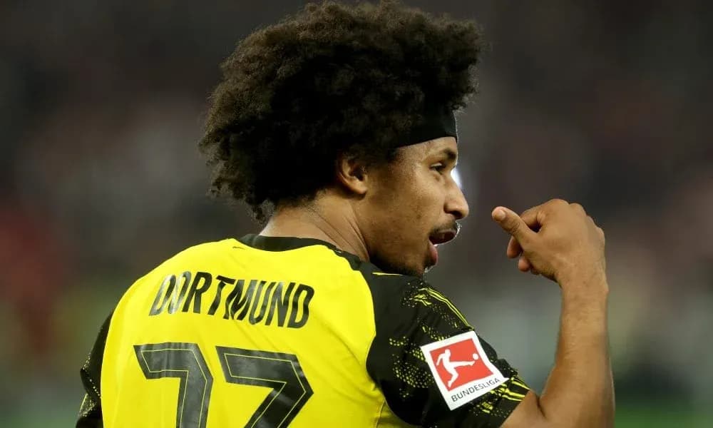 Player in Borussia Dortmund jersey gestures on field Player in Borussia Dortmund jersey gestures on field