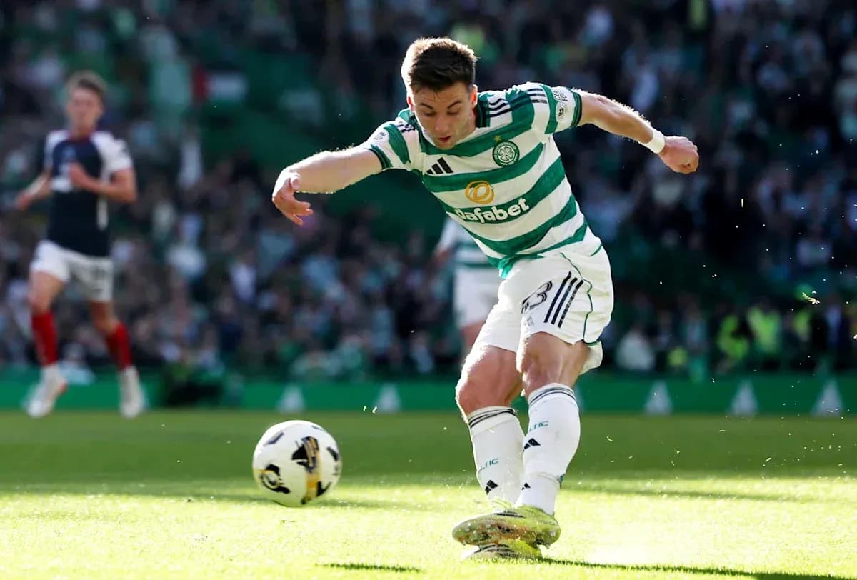 Player kicking ball during a football match Player kicking ball during a football match