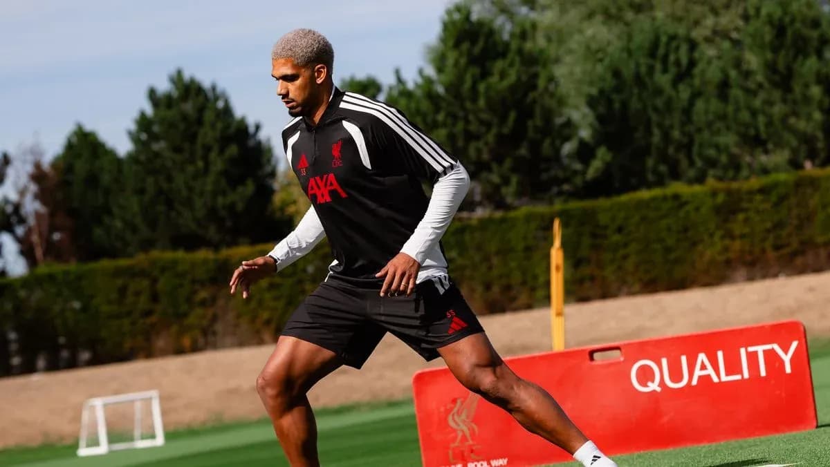 Player training on the pitch wearing Liverpool kit Player training on the pitch wearing Liverpool kit