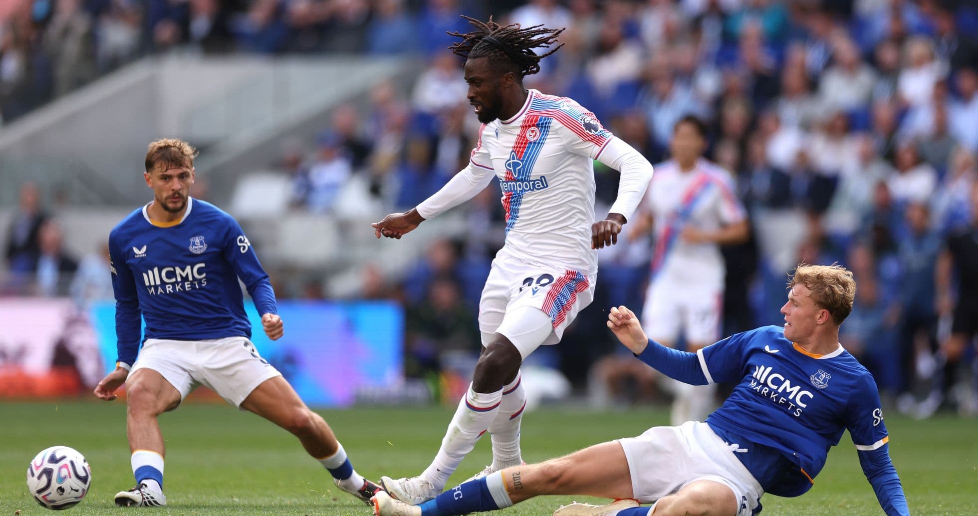 Player dribbling past opponents during match Player dribbling past opponents during match