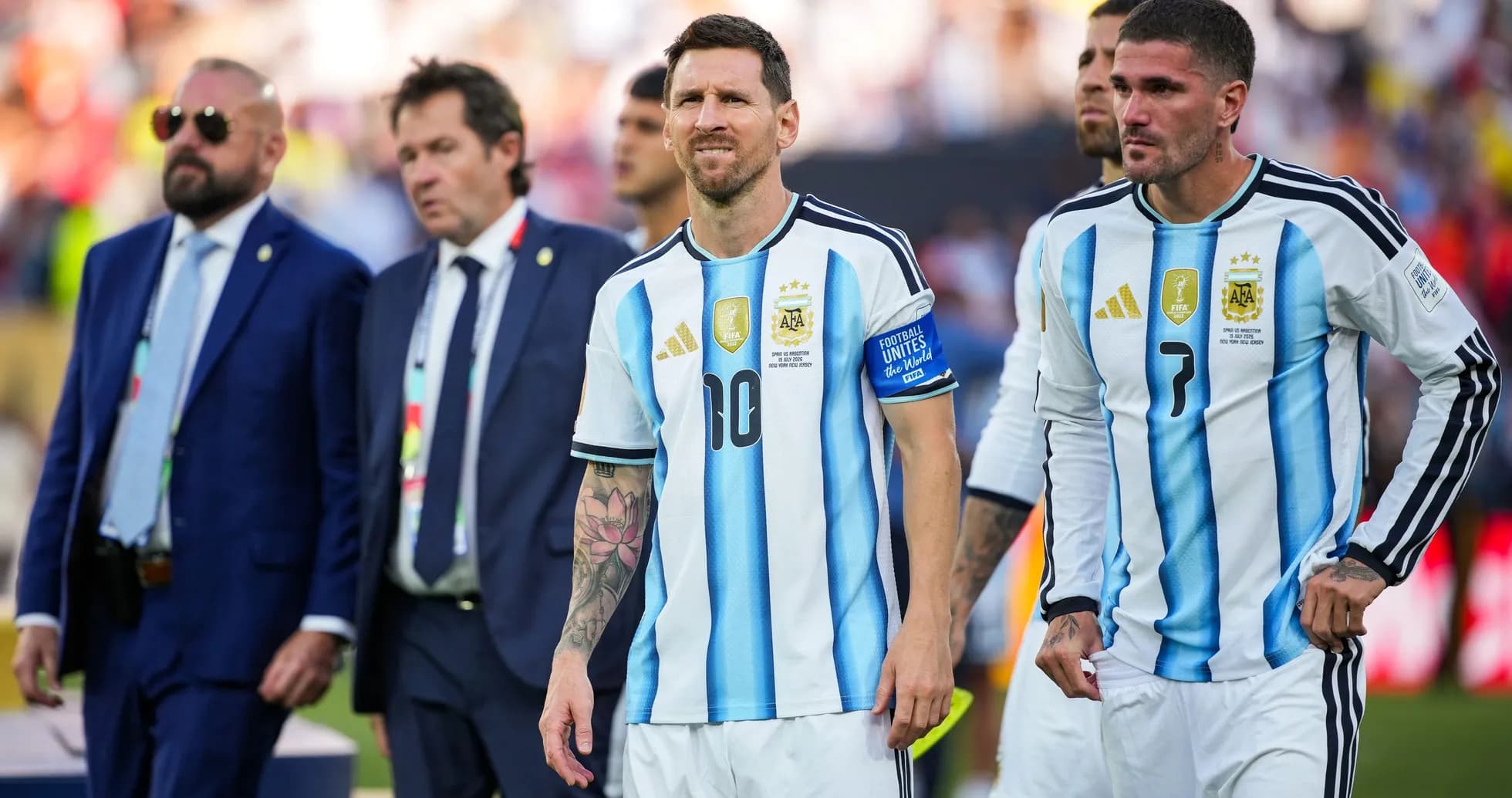 Lionel Messi and teammates walking off the pitch Lionel Messi and teammates walking off the pitch