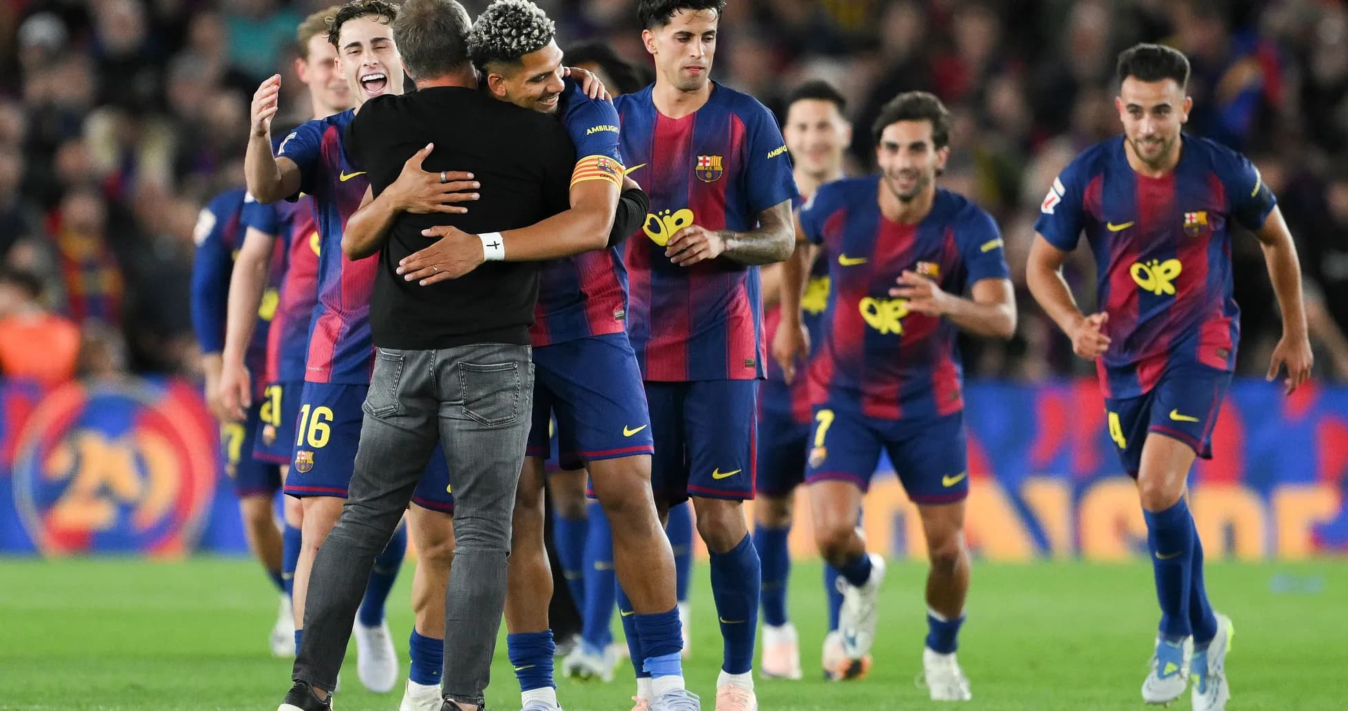 Barcelona players celebrating with manager after match Barcelona players celebrating with manager after match
