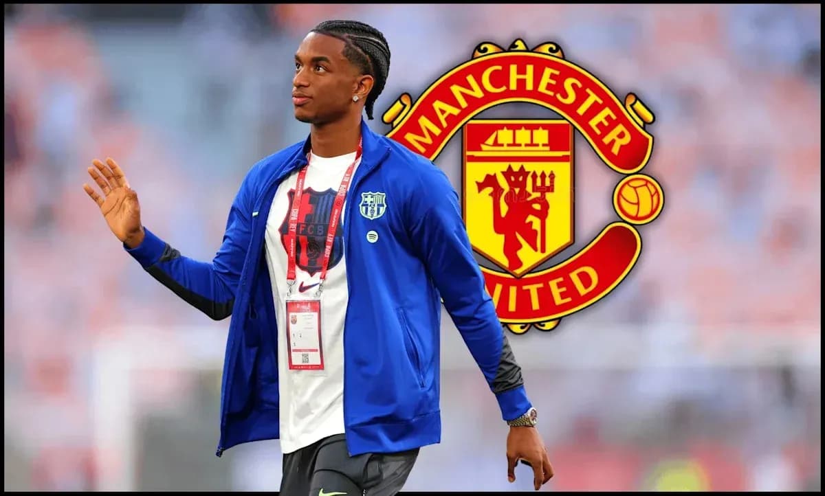 Player walking with Manchester United logo in background Player walking with Manchester United logo in background