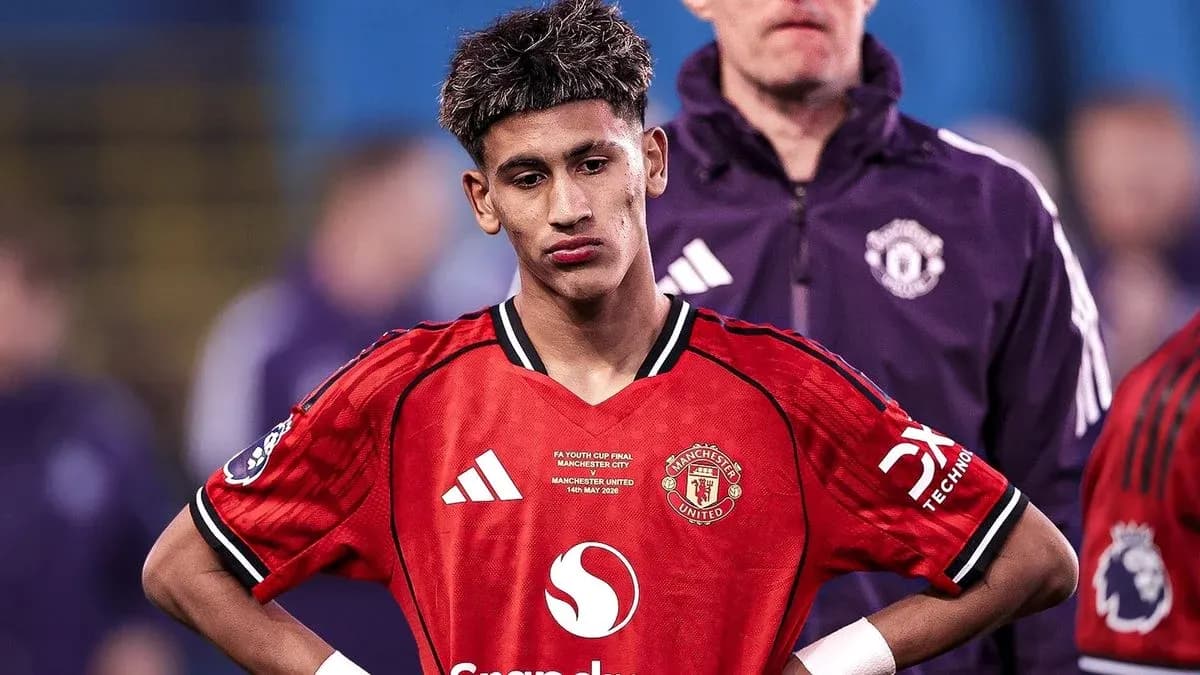 Manchester United player looking down after match Manchester United player looking down after match