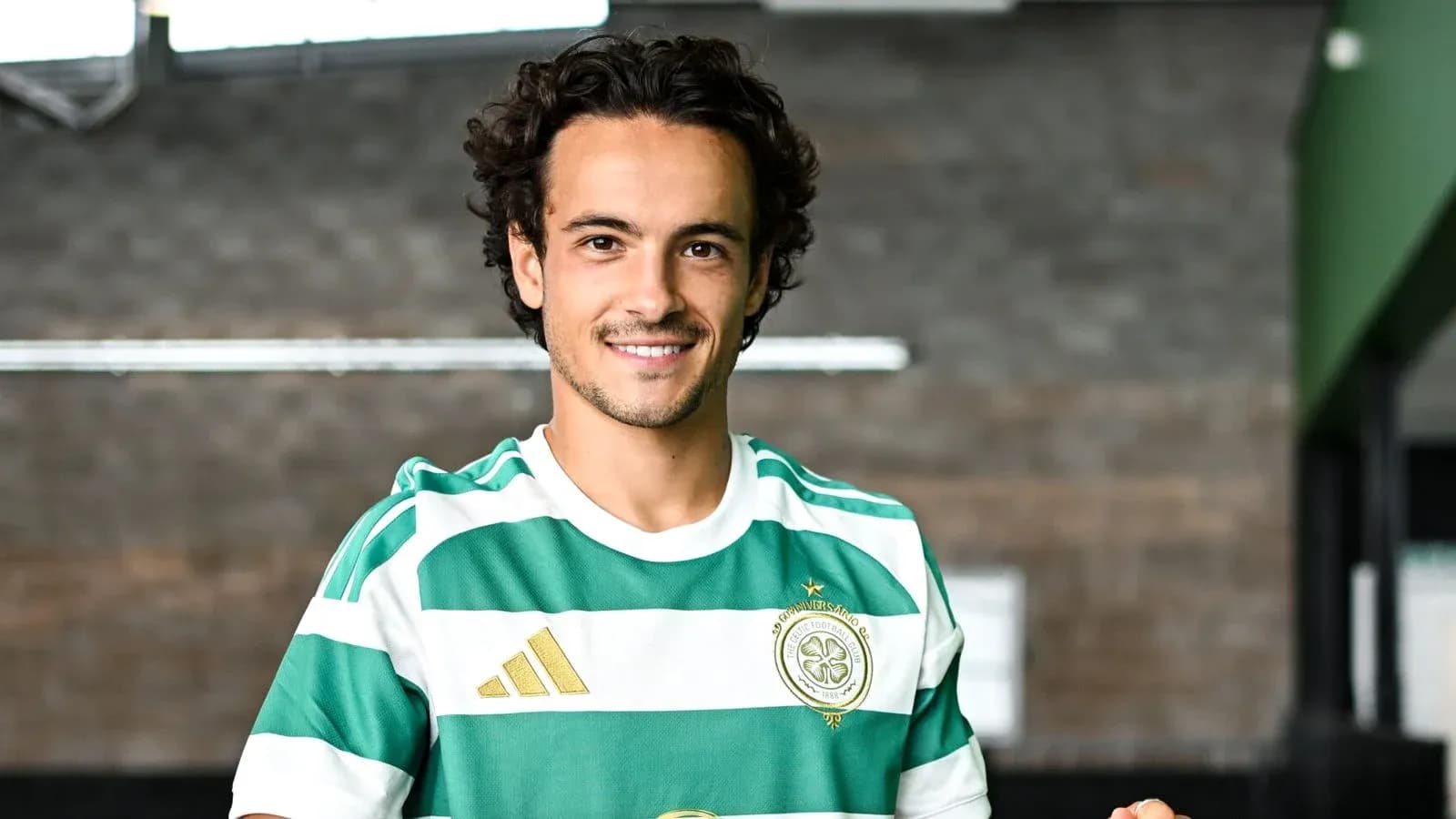 Player in green and white striped jersey posing Player in green and white striped jersey posing