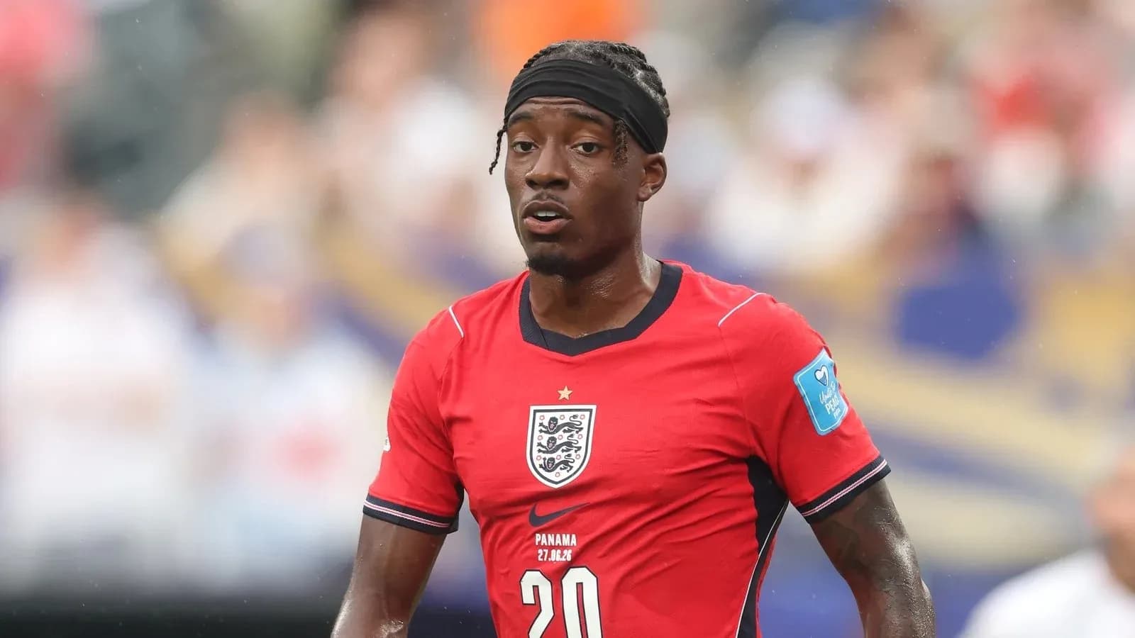 Player in red England kit during match action Player in red England kit during match action