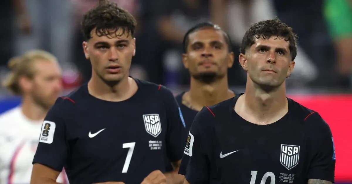 Three USMNT players walking off the field Three USMNT players walking off the field