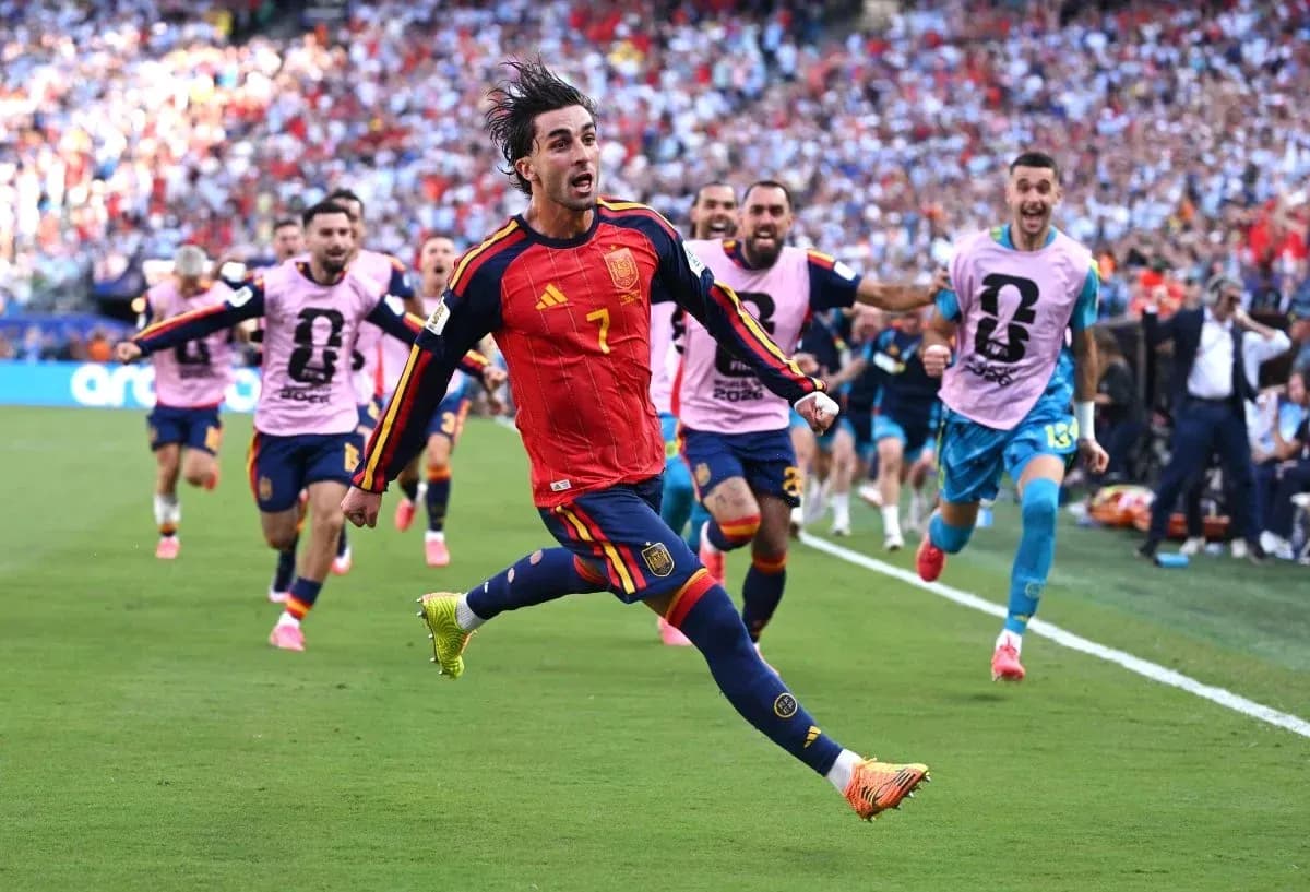 Spanish player celebrating goal with teammates in match Spanish player celebrating goal with teammates in match