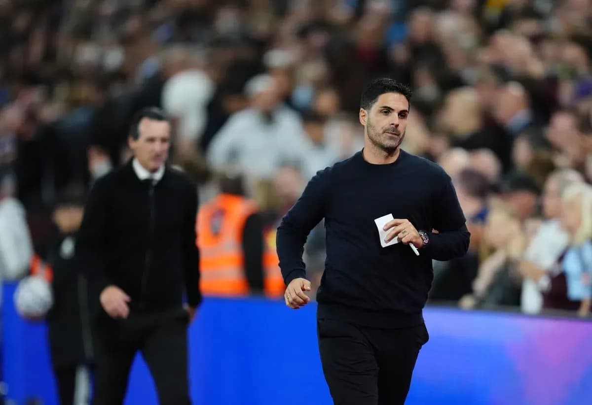 Two football managers walking on the pitch Two football managers walking on the pitch