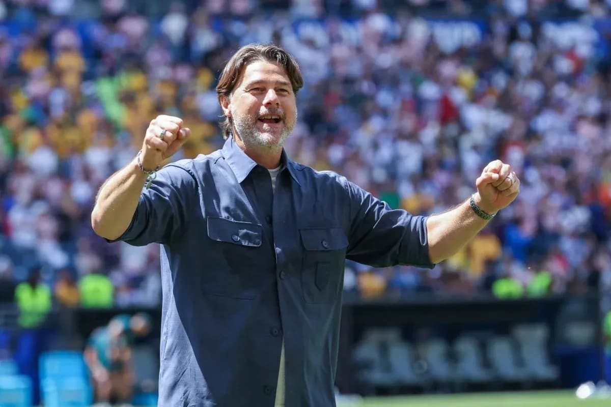 Coach celebrating during a match at the stadium Coach celebrating during a match at the stadium