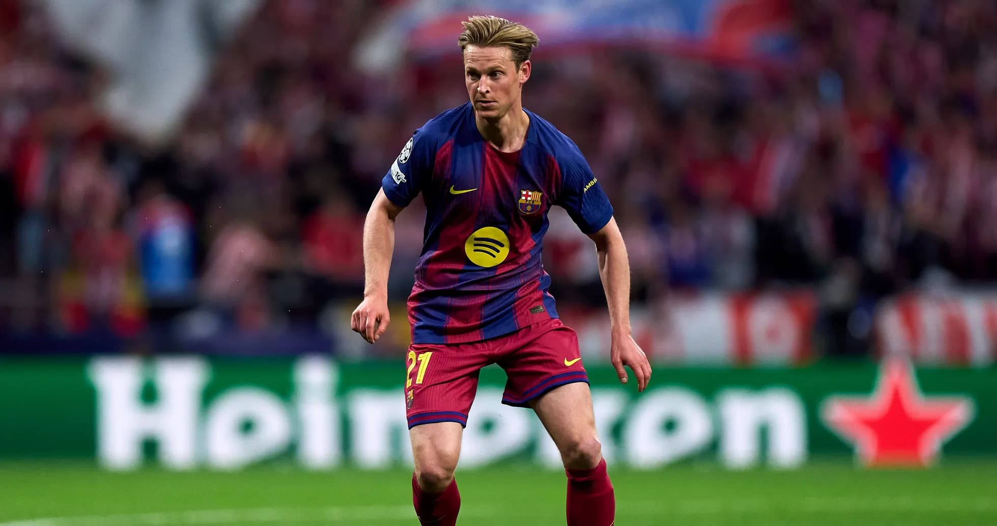 Player in Barcelona kit running on the field Player in Barcelona kit running on the field