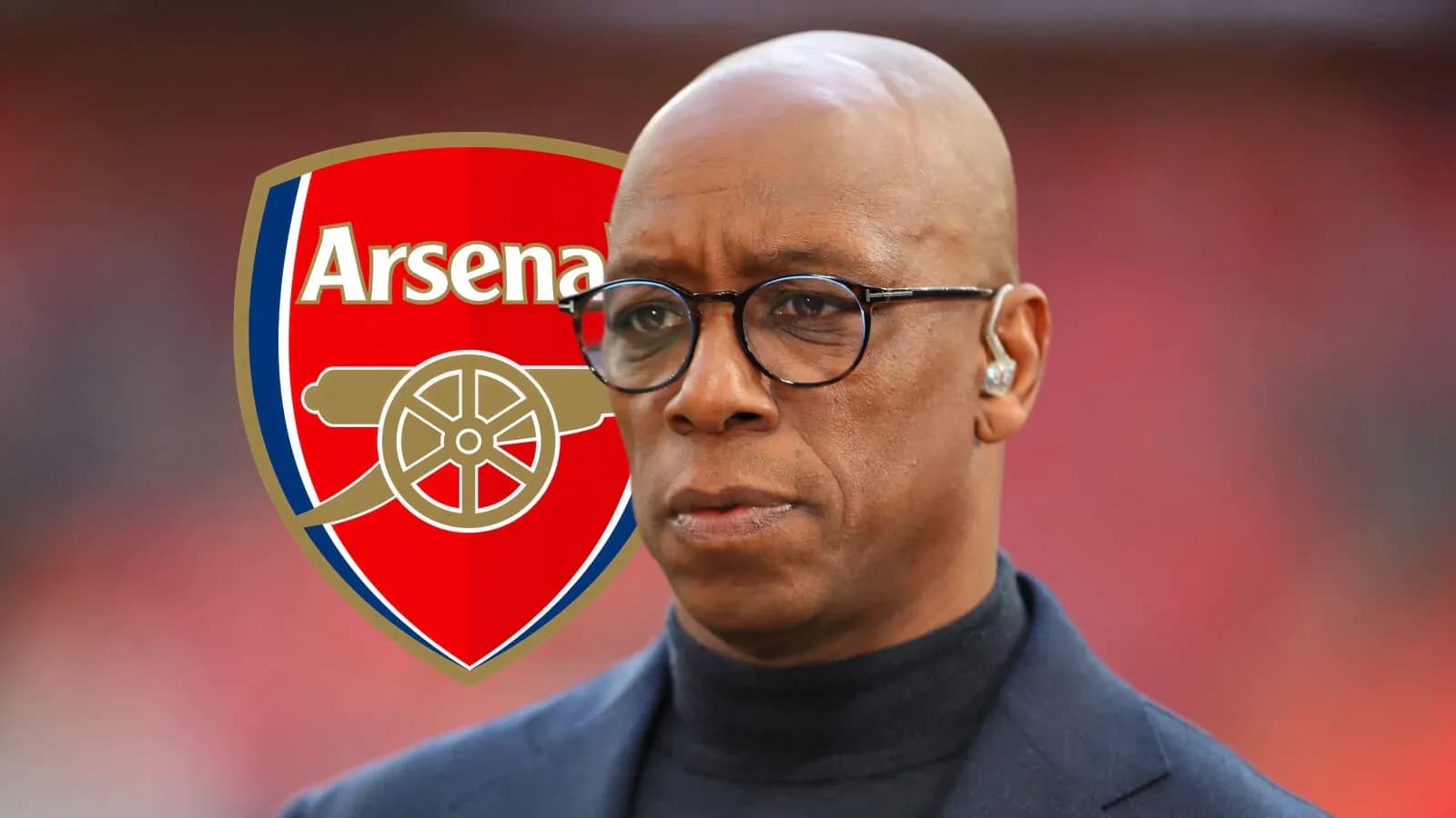 Person with glasses in front of Arsenal logo Person with glasses in front of Arsenal logo