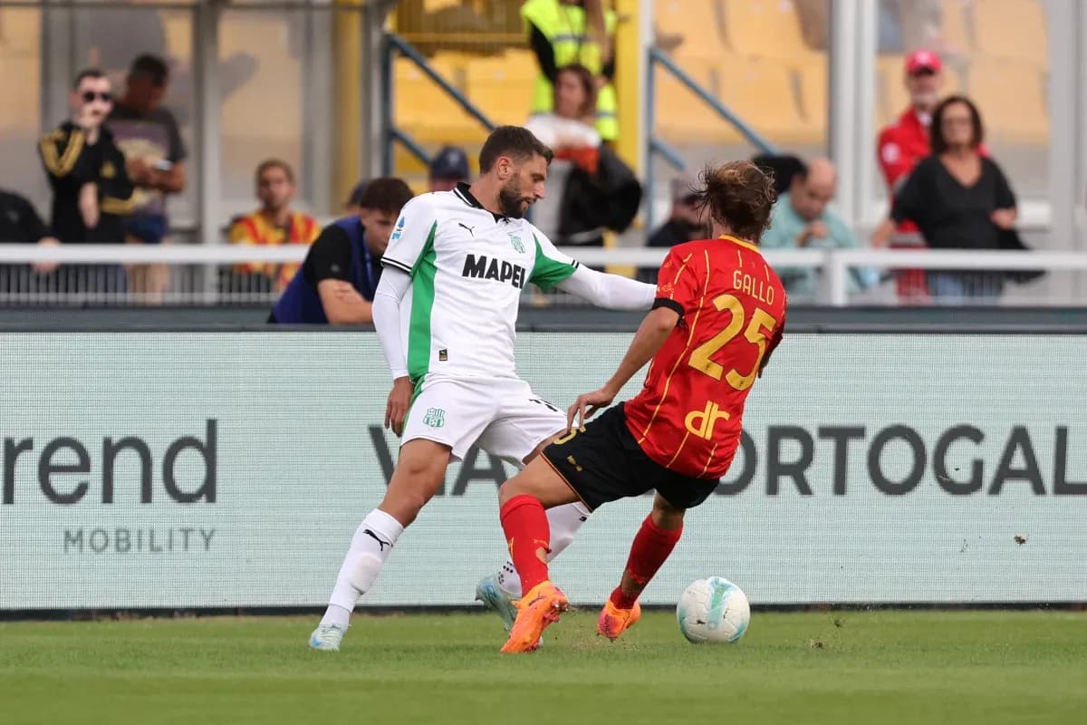 Sassuolo player challenging Lecce player for the ball Sassuolo player challenging Lecce player for the ball