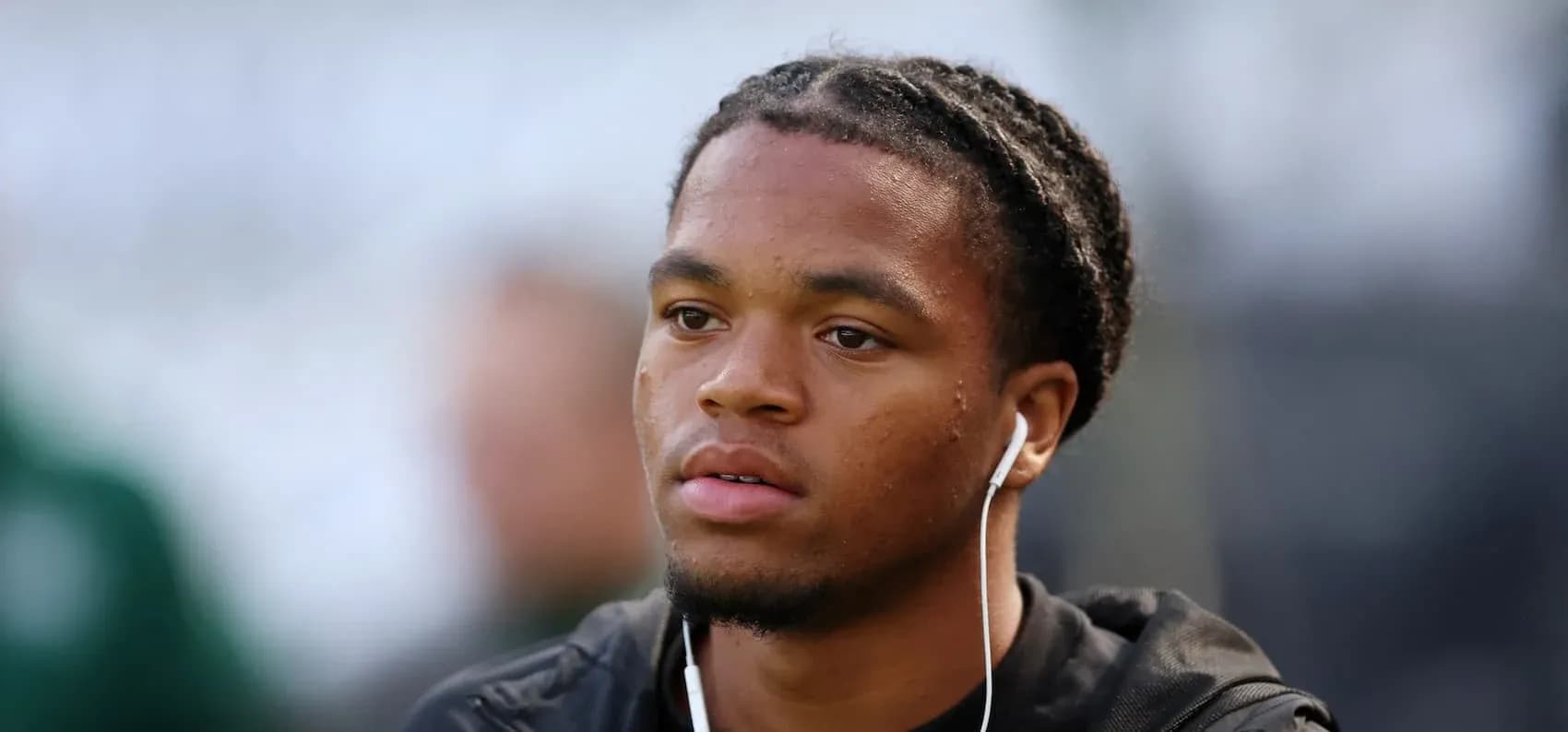 Player wearing earphones before the match Player wearing earphones before the match