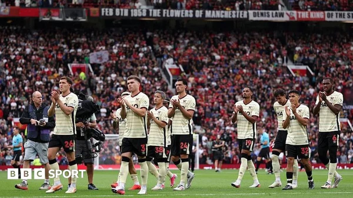 Team applauding fans after match at stadium Team applauding fans after match at stadium