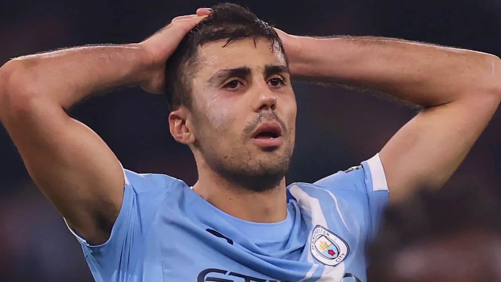 Manchester City player with hands on head in frustration Manchester City player with hands on head in frustration