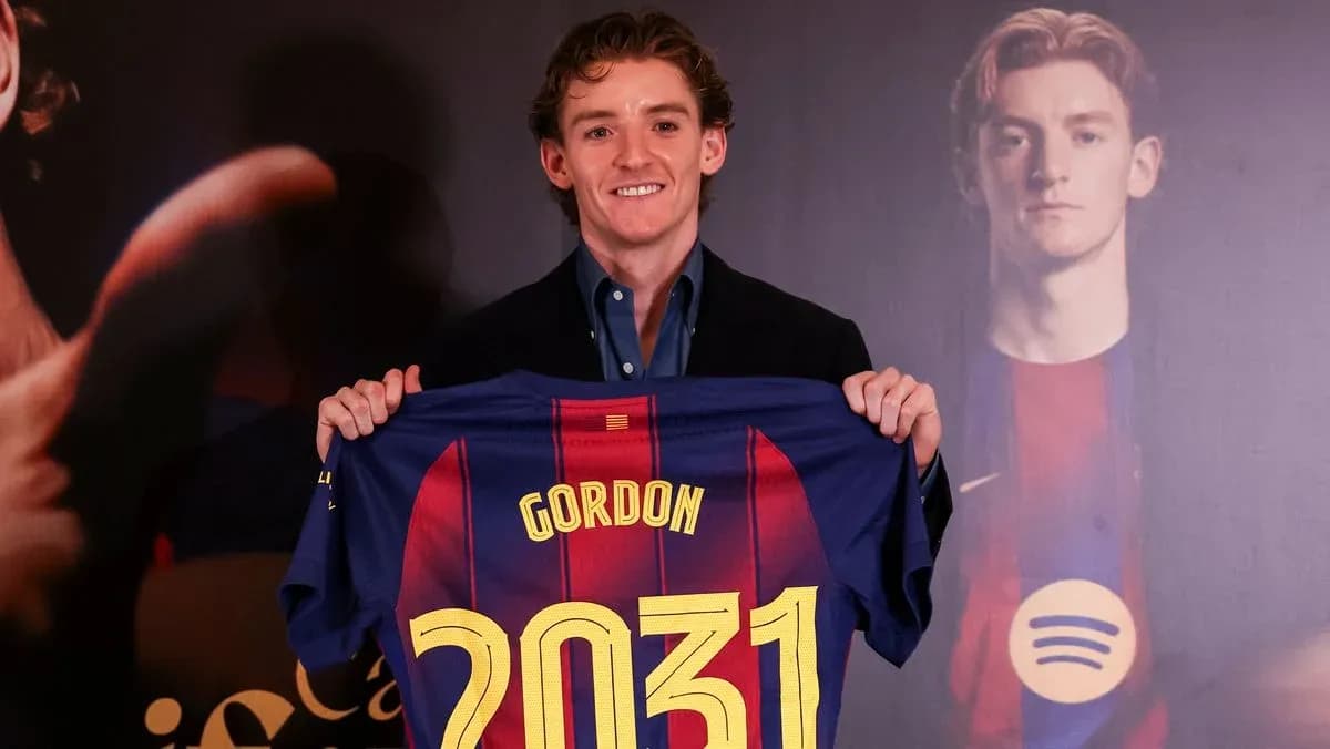 Player holding Barcelona jersey with name and number Player holding Barcelona jersey with name and number