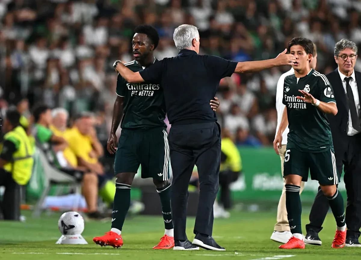 Coach instructing players during match substitution Coach instructing players during match substitution